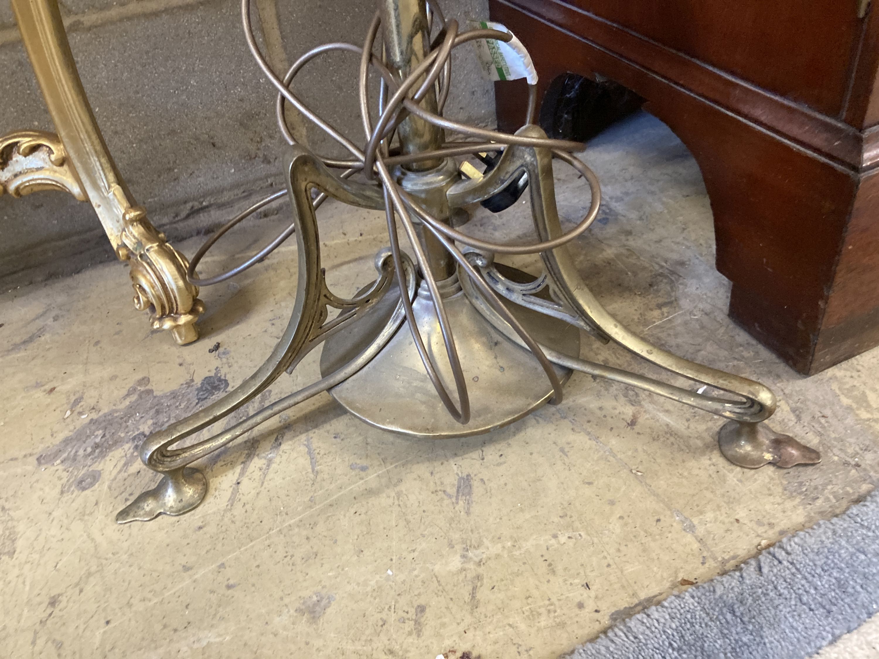 An Art Nouveau brass telescopic standard lamp